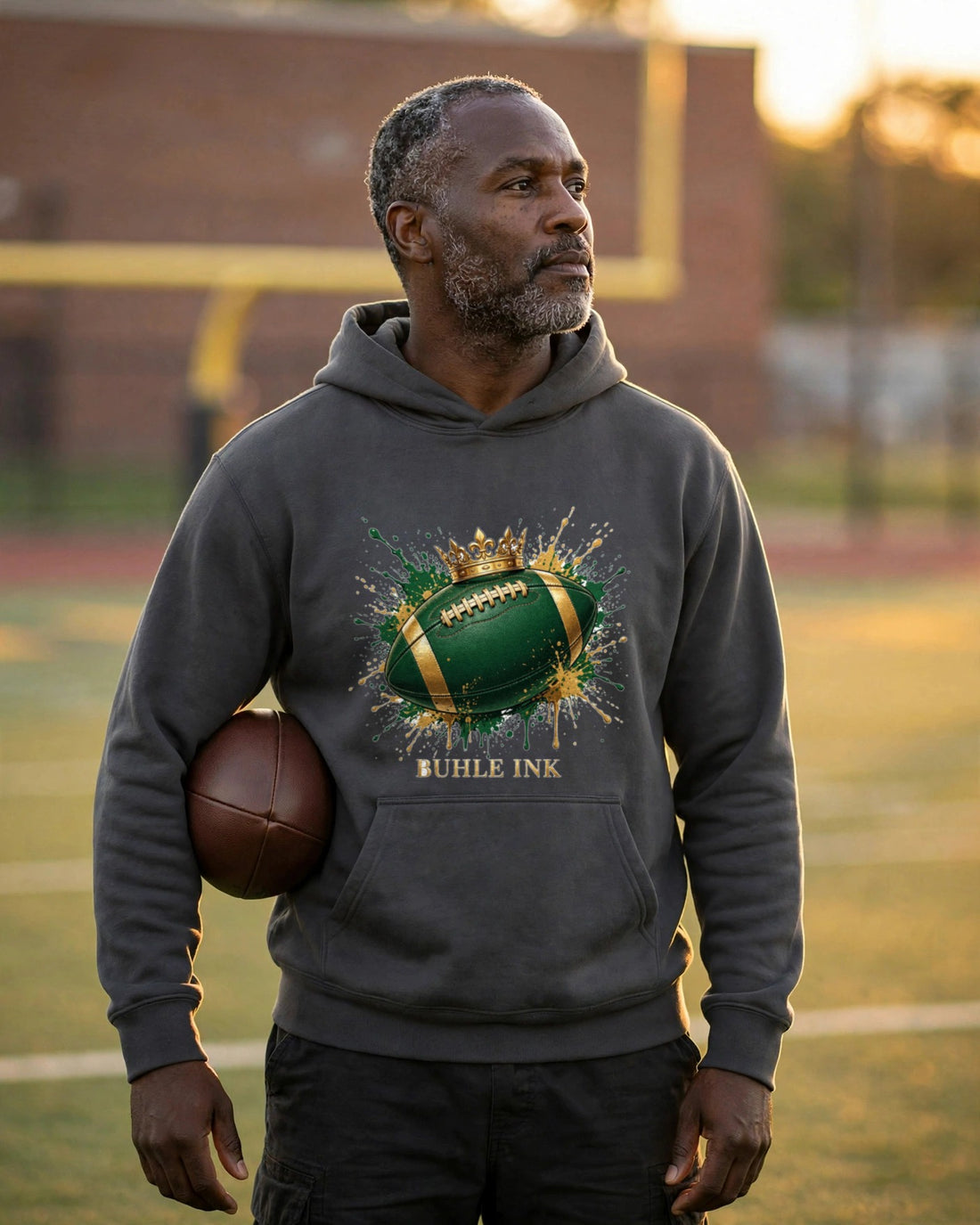 Crowned Football Hoodie — crowned design worn by a model
